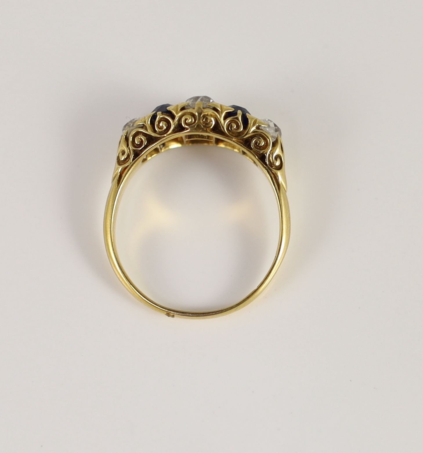 A Victorian style 18ct gold, four stone old round diamond and two stone sapphire set ring